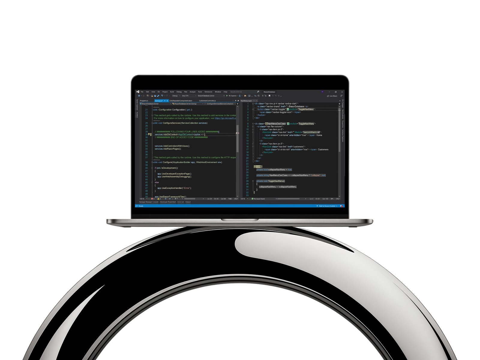 Laptop on a chrome stand displaying custom software in development